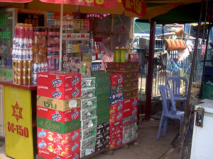 a shop selling cases of beer in cambodia, anchor, angkor, klang, m-150, black panther, tiger